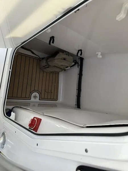 Slide: The Image of 2020 Sportsman 241 Heritage boat storage compartment, spacious and clean interior. - 16