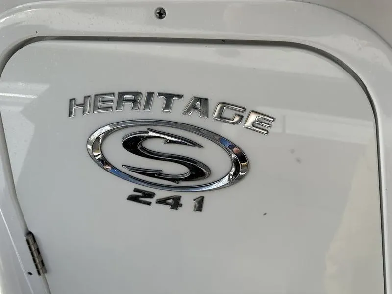 Slide: The Image of 2020 Sportsman 241 Heritage boat emblem on white surface. - 19