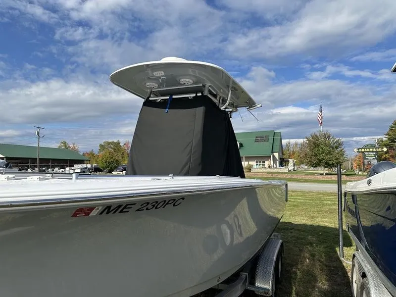 Slide: The Image of 2020 Sportsman 241 Heritage boat on trailer under cloudy sky. - 20