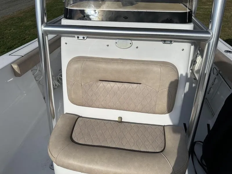 Slide: The Image of 2020 Sportsman 241 Heritage boat seat with beige upholstery and stainless steel frame. - 4