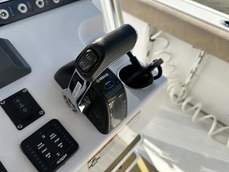 Slide: The Image of Close-up of 2020 Sportsman 241 Heritage boat controls and throttle. - 8