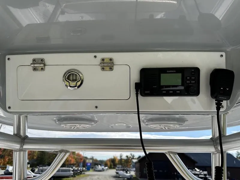 Slide: The Image of 2020 Sportsman 241 Heritage boat console with Garmin radio and storage compartment. - 9
