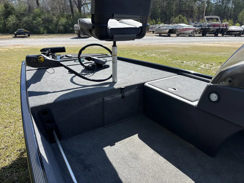 Slide: The Image of 2025 Tracker Bass Tracker Classic XL boat interior with seating and control panel. - 7