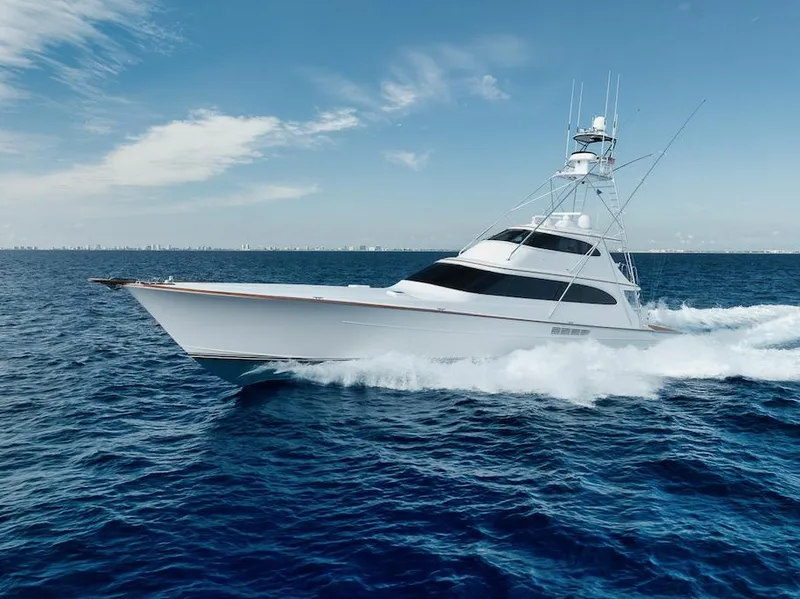 Slide: The Image of 2016 Merritt 86' Enclosed Flybridge yacht cruising on open ocean. - 10