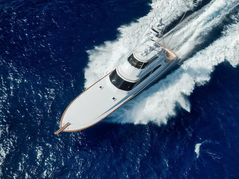 Slide: The Image of Aerial view of 2016 Merritt 86' Enclosed Flybridge yacht cruising on blue ocean waters. - 13