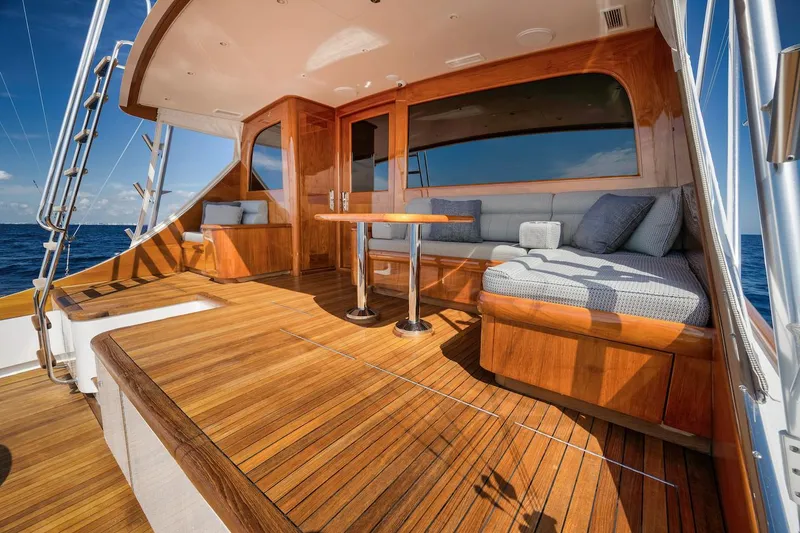 Slide: The Image of Luxurious 2016 Merritt 86' Enclosed Flybridge yacht with elegant wooden deck and seating area. - 14