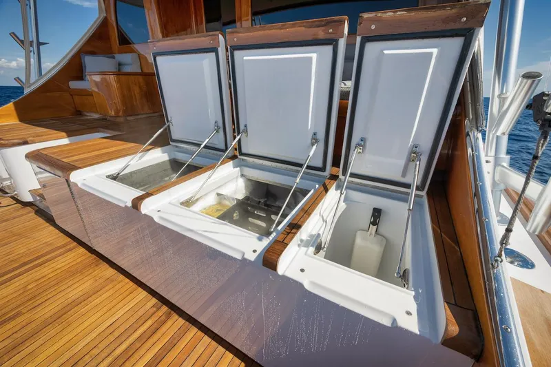 Slide: The Image of Open storage compartments on 2016 Merritt 86' Enclosed Flybridge yacht deck. - 19