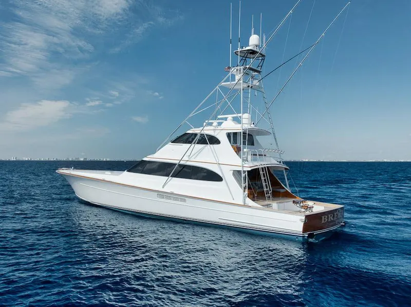 Slide: The Image of 2016 Merritt 86' Enclosed Flybridge yacht on open sea under clear sky. - 2