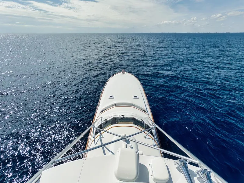 Slide: The Image of Bow view of 2016 Merritt 86' Enclosed Flybridge yacht on open sea. - 24