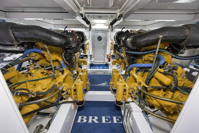 Slide: The Image of Engine room of 2016 Merritt 86' Enclosed Flybridge yacht, showcasing powerful dual engines. - 28
