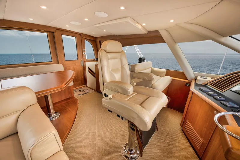 Slide: The Image of Luxurious interior of 2016 Merritt 86' Enclosed Flybridge yacht with leather seating and ocean view. - 35