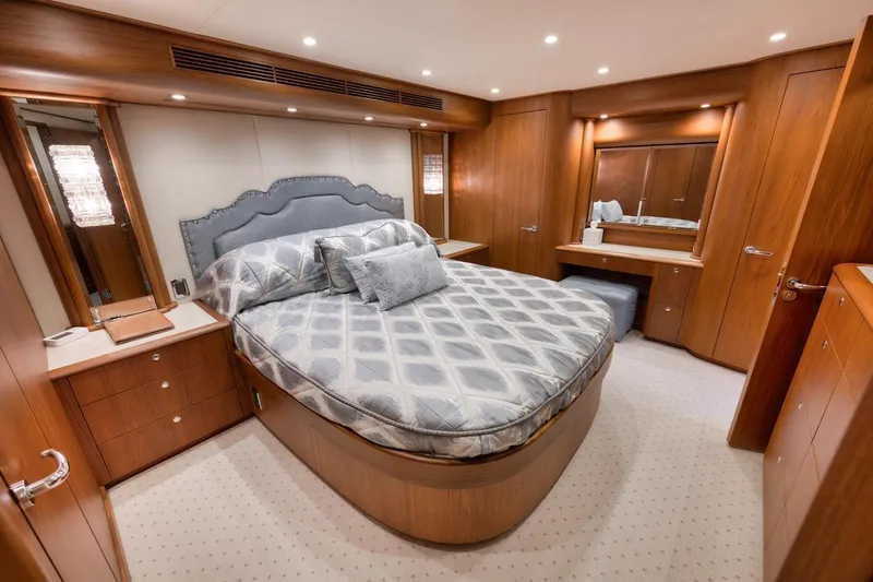 Slide: The Image of Luxurious bedroom in 2016 Merritt 86' Enclosed Flybridge yacht with elegant wood finishes. - 47