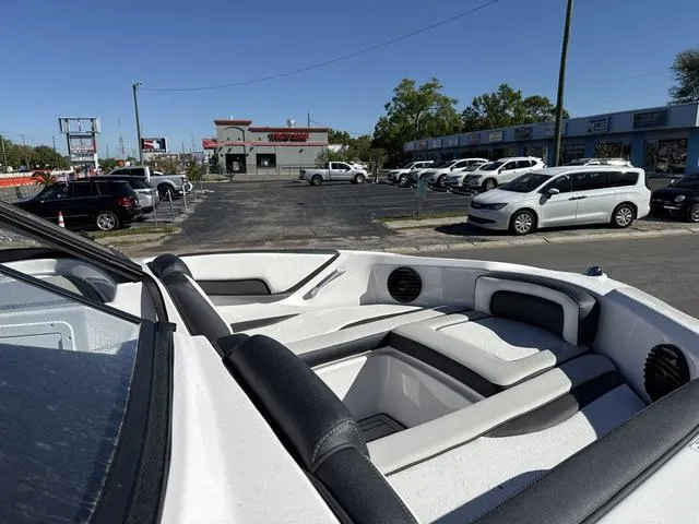 Slide: The Image of 2025 Yamaha Boats 195S interior, featuring sleek helm and modern controls in mist gray. - 10