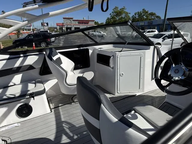 Slide: The Image of 2025 Yamaha Boats 195S interior, mist gray upholstery, sleek design, comfortable seating. - 12