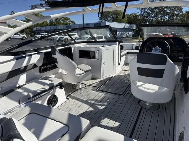 Slide: The Image of 2025 Yamaha Boats 195S in mist gray, featuring sleek seating and modern design. - 13