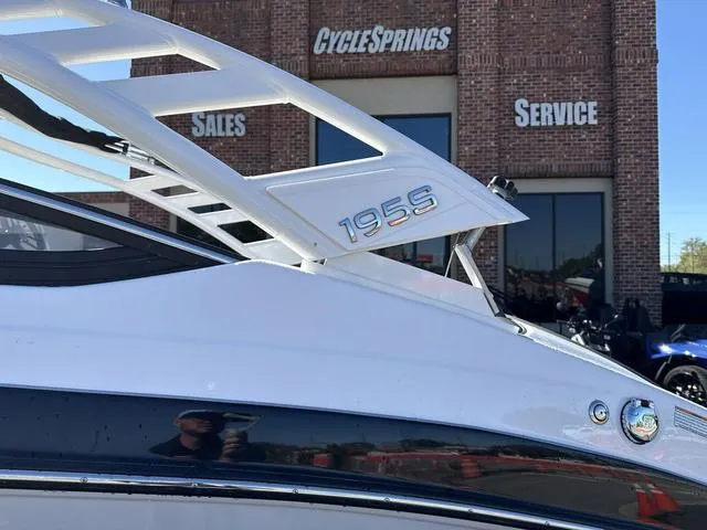 Slide: The Image of 2025 Yamaha Boats 195S in mist gray, side view on trailer. - 3