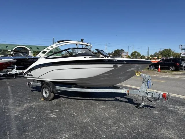 Slide: The Image of 2025 Yamaha Boats 195S, Mist Gray, galvanized deck with cushioned seating. - 6