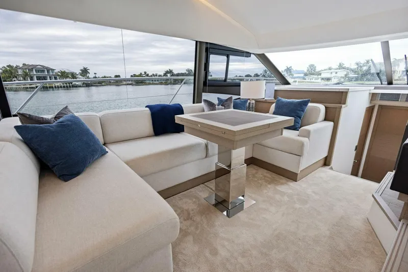 Slide: The Image of Luxurious interior of 2022 Prestige 520 yacht with elegant seating and waterfront view. - 11