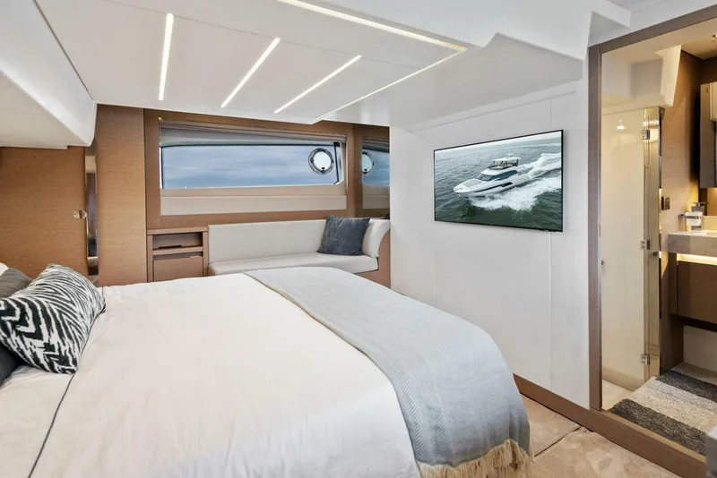 Slide: The Image of Luxurious interior of 2022 Prestige 520 yacht with modern bedroom and ocean view. - 14