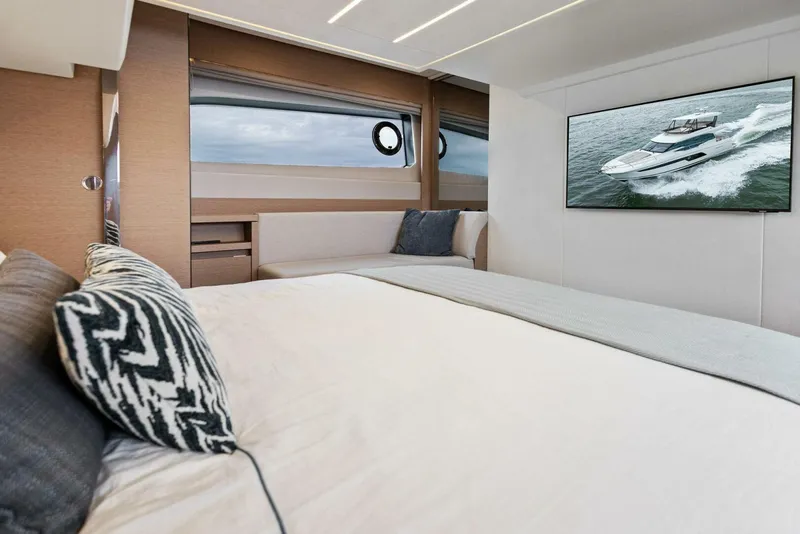 Slide: The Image of Luxurious interior of 2022 Prestige 520 yacht with modern decor and large windows. - 15