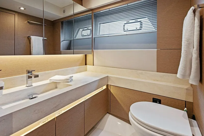 Slide: The Image of Luxurious bathroom in 2022 Prestige 520 yacht with modern fixtures and elegant design. - 16