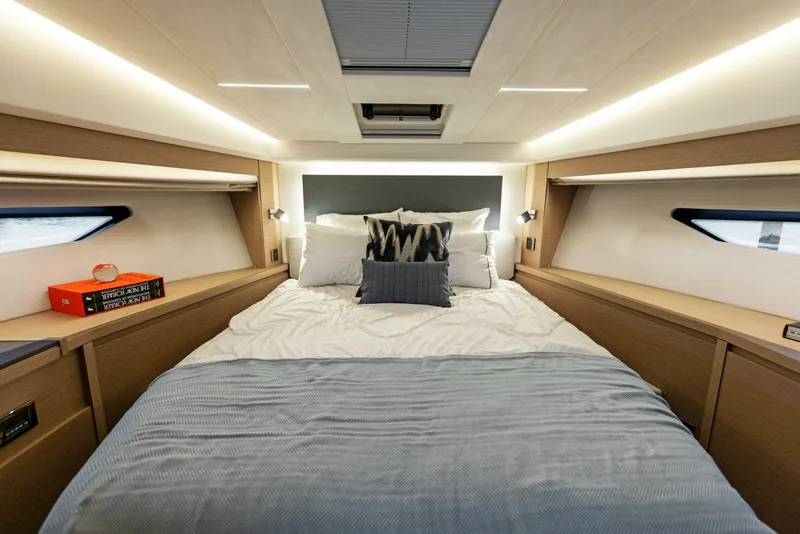 Slide: The Image of Luxurious bedroom interior of 2022 Prestige 520 yacht with modern design and ambient lighting. - 18