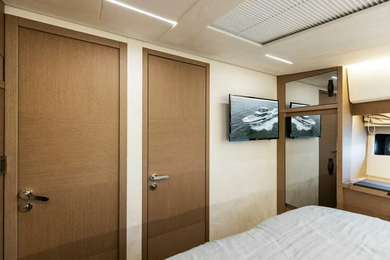 Slide: The Image of Interior of 2022 Prestige 520 yacht cabin with modern design and wooden doors. - 22