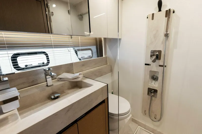 Slide: The Image of Luxurious bathroom in 2022 Prestige 520 yacht with modern fixtures and elegant design. - 23