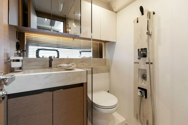 Slide: The Image of Luxurious bathroom in 2022 Prestige 520 yacht with modern fixtures and elegant design. - 24