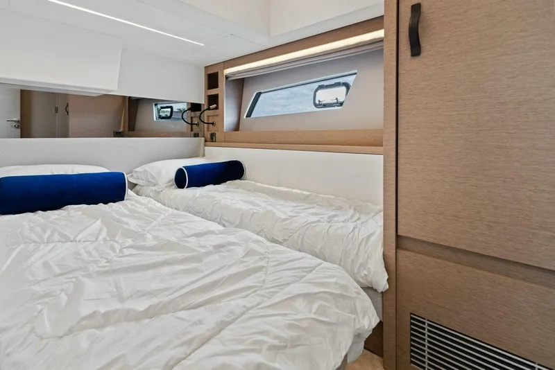 Slide: The Image of Luxurious cabin interior of 2022 Prestige 520 yacht with twin beds and modern design. - 25