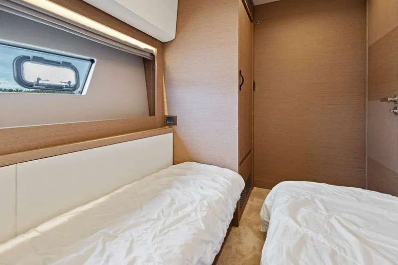 Slide: The Image of Interior of 2022 Prestige 520 yacht cabin with twin beds and modern design. - 26