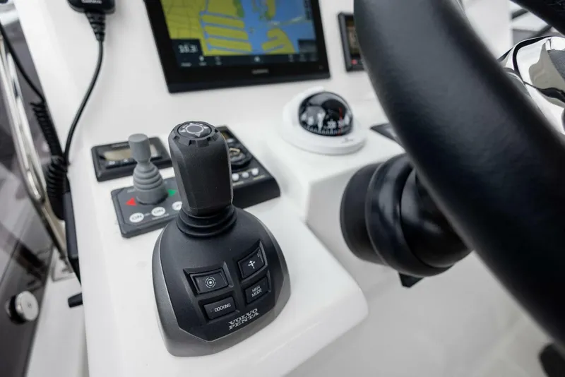 Slide: The Image of Prestige 520 yacht helm with joystick control and navigation display, 2022 model. - 38