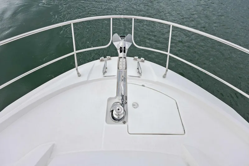 Slide: The Image of Bow of 2022 Prestige 520 yacht with stainless steel railings on calm water. - 41