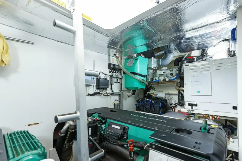 Slide: The Image of Engine room of 2022 Prestige 520 yacht, featuring advanced mechanical systems and equipment. - 43