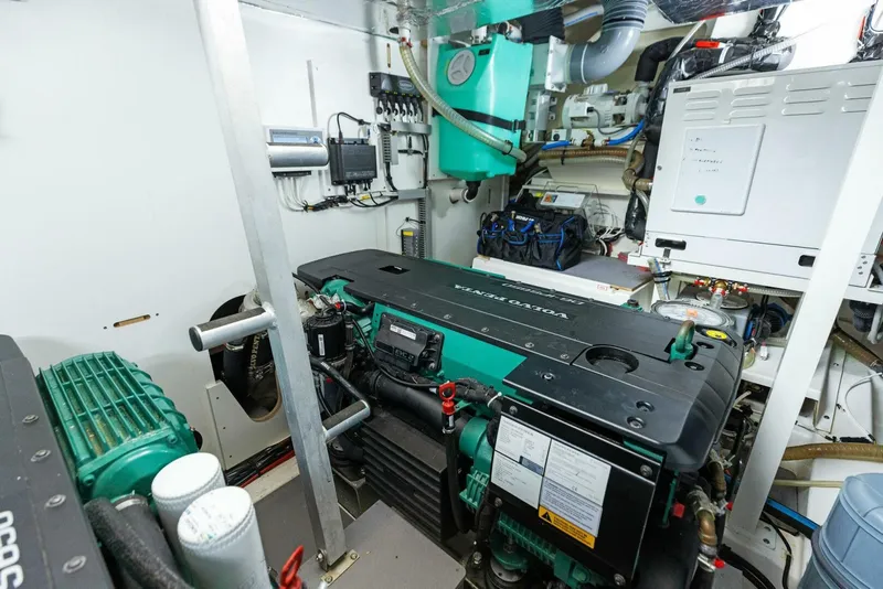 Slide: The Image of Engine room of 2022 Prestige 520 yacht, featuring advanced machinery and equipment. - 44