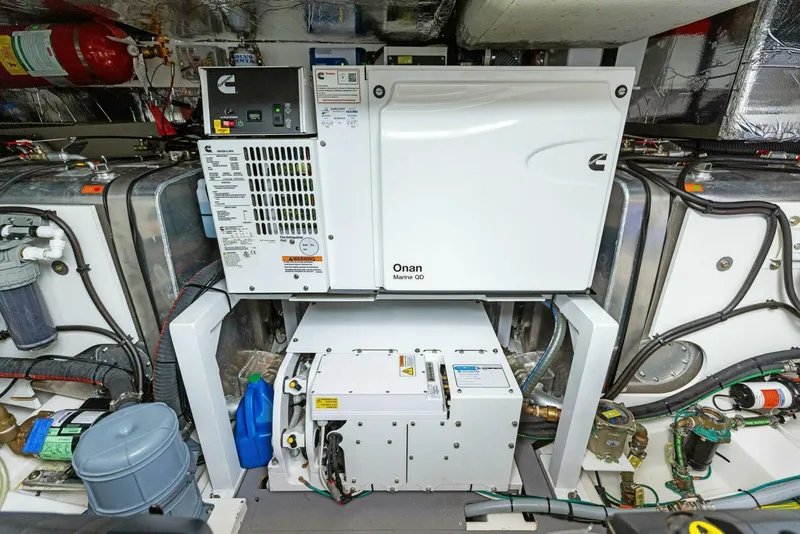 Slide: The Image of Engine room of 2022 Prestige 520 yacht with Onan generator and equipment. - 45