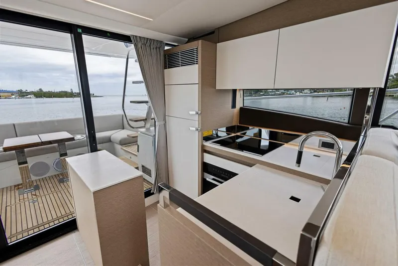 Slide: The Image of Modern kitchen interior on 2022 Prestige 520 yacht with sleek design and waterfront view. - 6