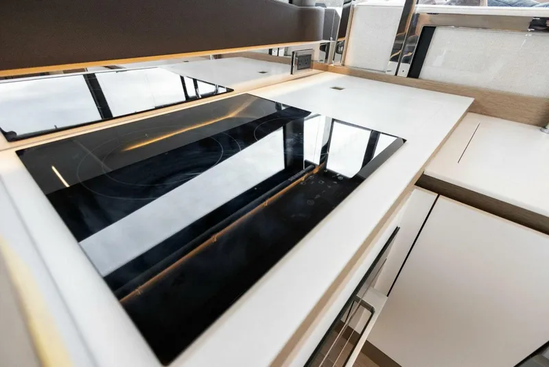 Slide: The Image of Modern kitchen with sleek induction cooktop on Prestige 520 yacht, 2022 model. - 7