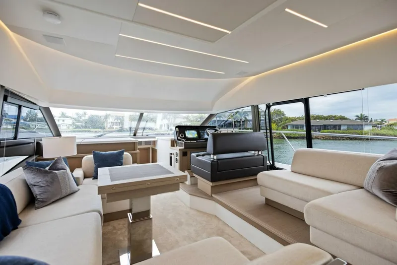 Slide: The Image of Luxurious interior of 2022 Prestige 520 yacht with modern seating and panoramic windows. - 8