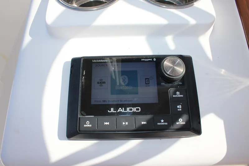 Slide: The Image of JL Audio system on 2022 Front Runner 26 Center Console boat dashboard. - 17