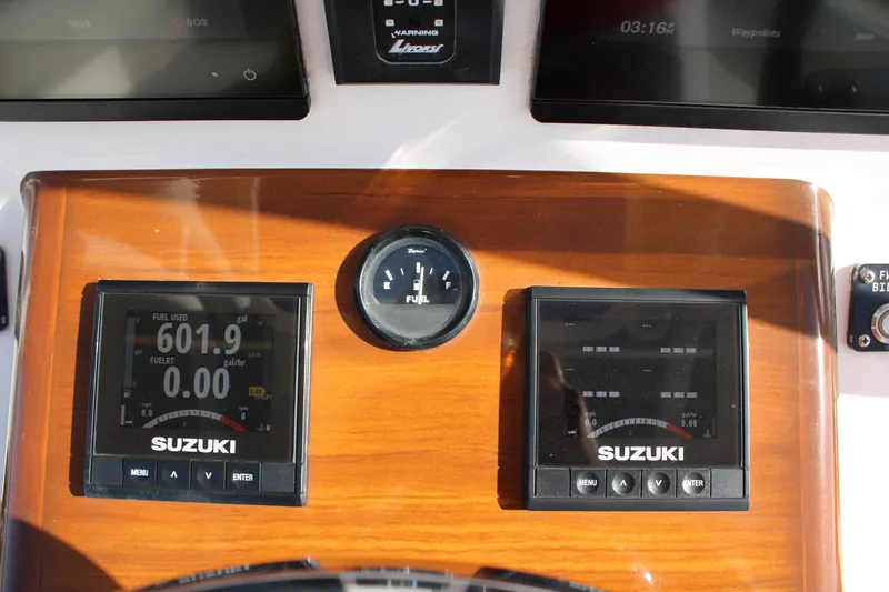 Slide: The Image of Dashboard of 2022 Front Runner 26 Center Console with Suzuki displays. - 20
