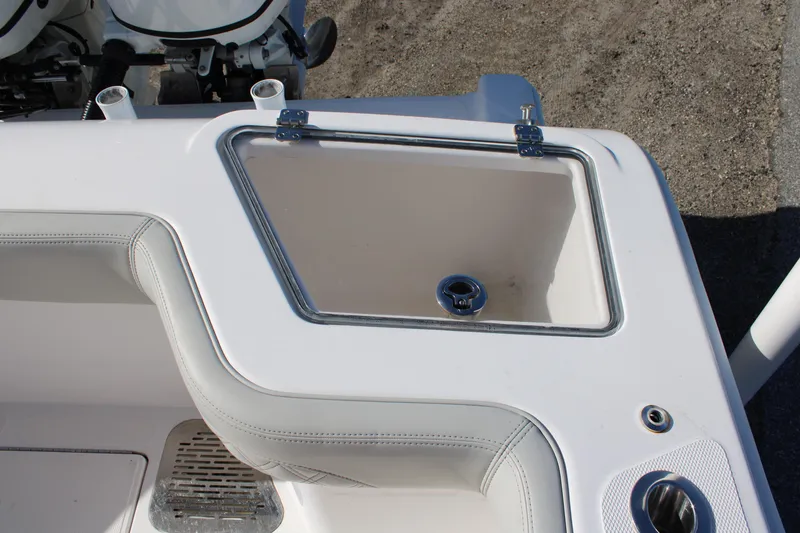 Slide: The Image of 2022 Front Runner 26 Center Console boat detail, featuring a storage compartment. - 27