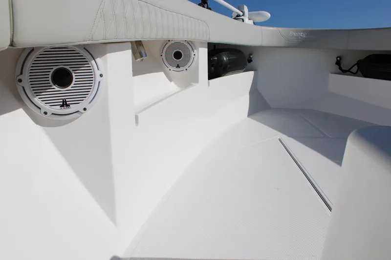 Slide: The Image of 2022 Front Runner 26 Center Console boat interior with speakers and seating. - 28