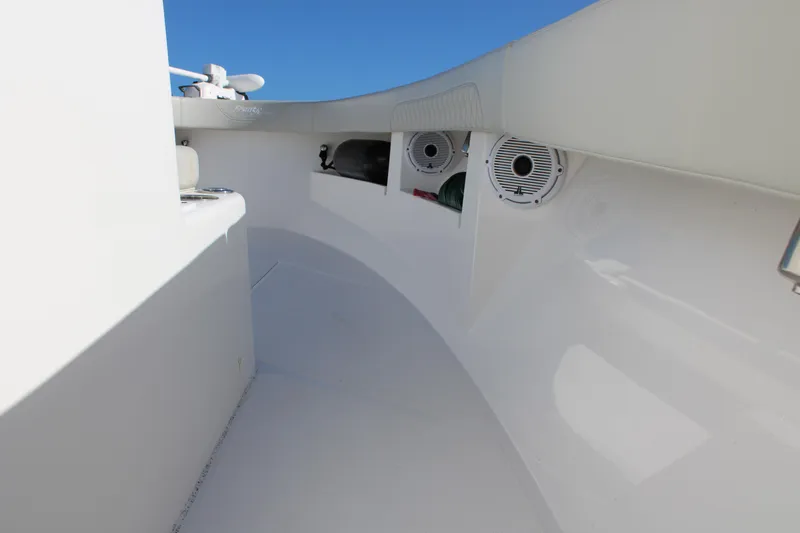 Slide: The Image of 2022 Front Runner 26 Center Console boat interior with speakers and storage compartments. - 29
