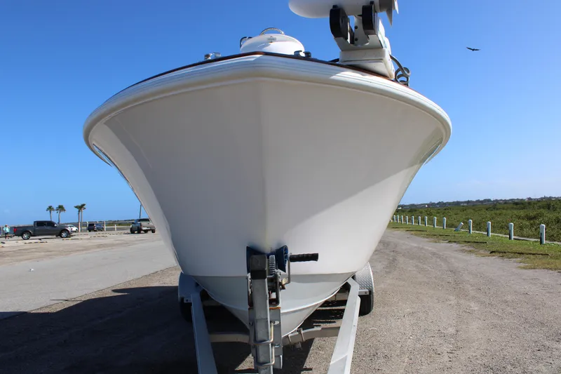 Slide: The Image of 2022 Front Runner 26 Center Console boat on trailer, parked outdoors. - 31