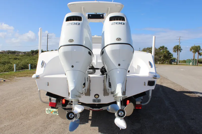 Slide: The Image of 2022 Front Runner 26 Center Console with twin outboard engines, rear view. - 32