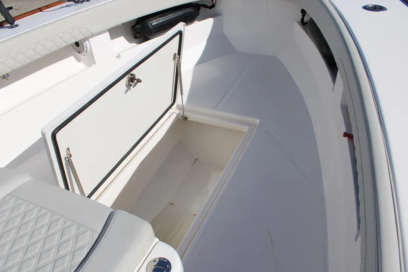 Slide: The Image of 2022 Front Runner 26 Center Console boat with open storage compartment. - 5