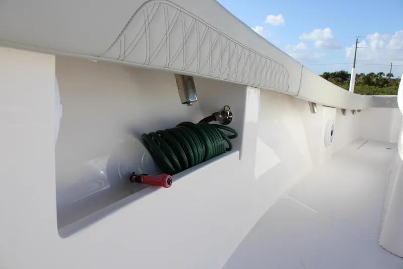Slide: The Image of 2022 Front Runner 26 Center Console boat with hose storage compartment. - 7