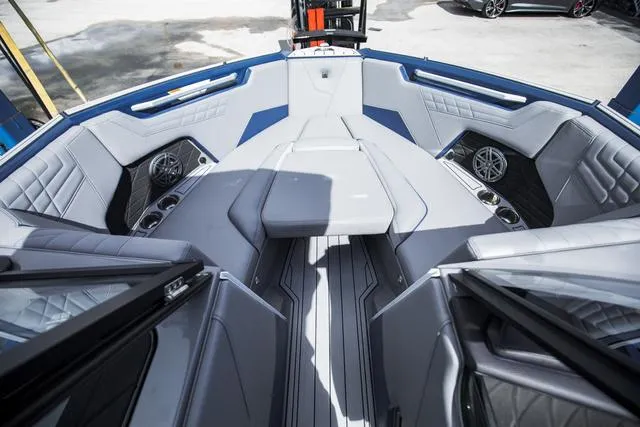 Slide: The Image of Luxurious interior of 2024 Nautique S23 boat with plush seating and modern design. - 23