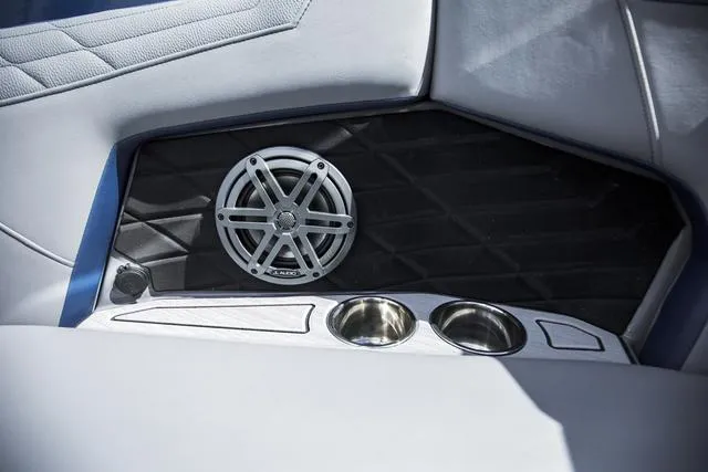 Slide: The Image of 2024 Nautique S23 interior speaker and cup holders detail. - 25